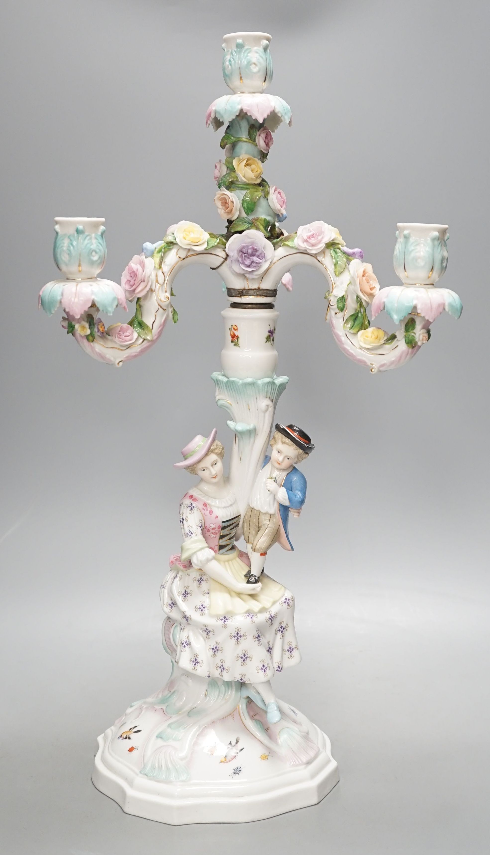 A Sitzendorf three branch candelabrum, 51.5 cms high.